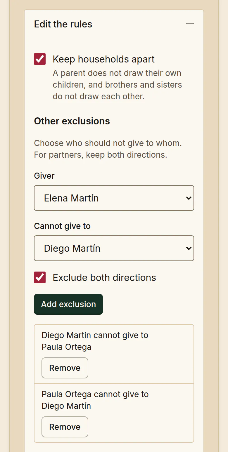 The Edit the rules panel in SantaTogether. Keep households apart is ticked. Under Other exclusions, Exclude both directions is ticked, and the list shows Diego Martín cannot give to Paula Ortega and Paula Ortega cannot give to Diego Martín.